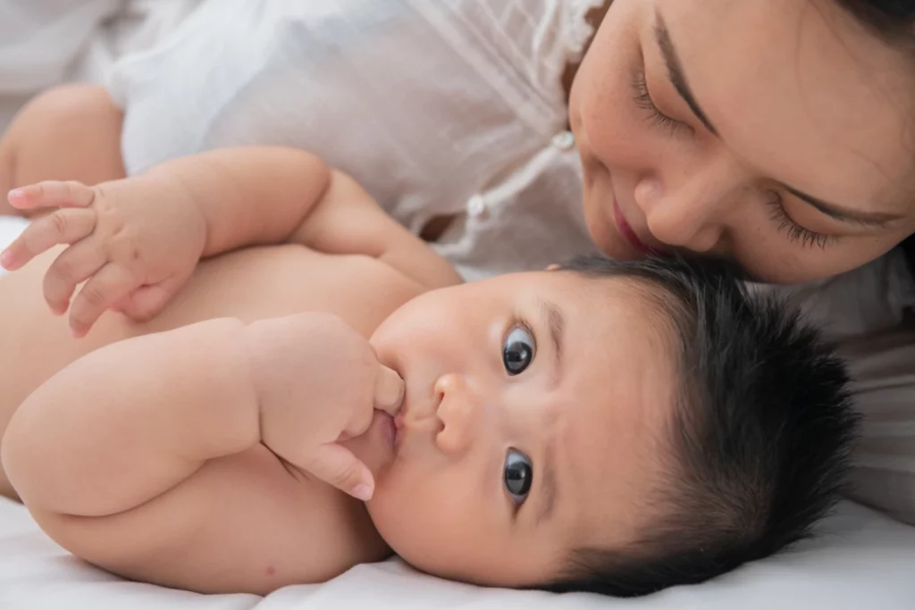 A loving mother bonding with her baby, emphasizing the importance of choosing safe and natural baby skincare products like Pigeon.
