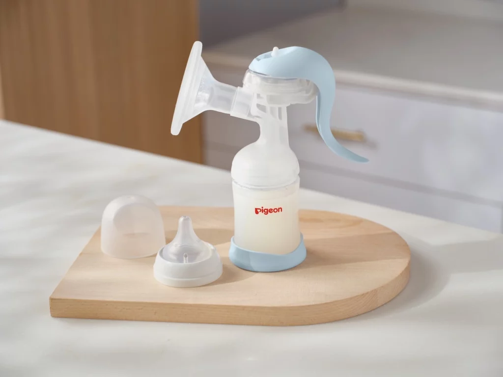 Pigeon Manual Breast Pump showcased on a kitchen counter - designed for effortless and comfortable milk expression in Malaysia.